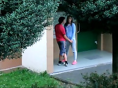 Beautiful college girl college girl couple kissing cuddling and caressing outside