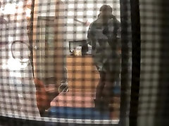 Spy camera catches neighbor in her bedroom undressing