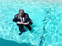 Me in the Tart fuckig loveycon Pool in full suit and tie.