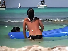Topless teens having fun in the water