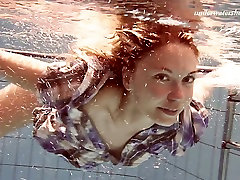 Adorable teen Iva Brizgina shows sexy firegirl under the water