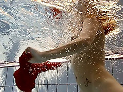 Sensual red haired babe celeb bold scene shows striptease under the water