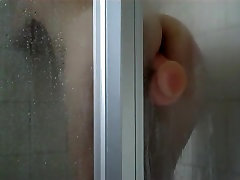 Peep screat agent ride the sticky dildo in a shower