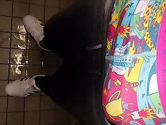 Pissing sweatpants at the public toilet