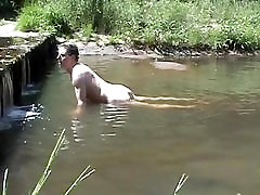 Humping and cumming on a stone in the river