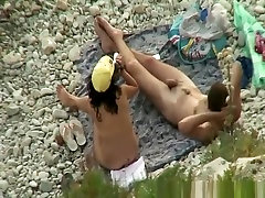Man gropes her womans tits in beach Man gropes her womans tits in beach