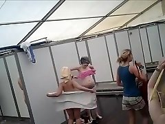 Dozens of actresses shower in tented locker area