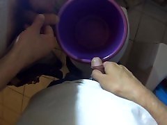 Pissing in a bucket together with my japanese tits cummed on friend