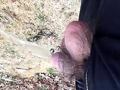 Pierced cock pissing outdoors