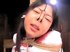 Japanese sex slave is strung up and gets her pussy toyed an Japanese sex slave is strung up and gets her pussy toyed an