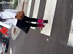 Teen in black leggings in the street