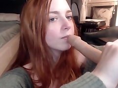 Redhead ginger practicing blowjob with dildo