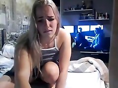 college girl masturbates on webcam with boyfriend in background
