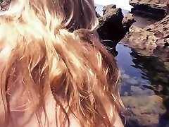 Amateur chick is fellating and sexing man on beach