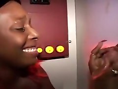 Buxom dark skinned nympho fulfills her need for cum at the gloryhole