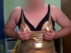 Fake Boobs - some posing in shiny gold swimsuit, shaved body