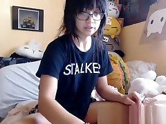 Cute asian teen playing with her sissy jennifer glasses doll