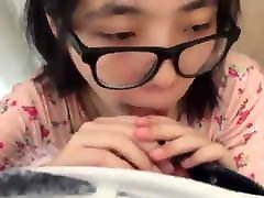 Cute Asian first time eating sausage