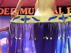 Arabian Belly Dancer in Blue Dress strips for Audience