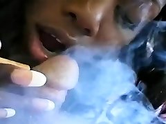 Older slut blows a chap whilst smoking a cigarette