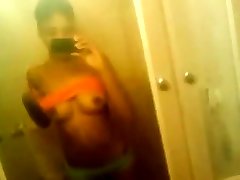 Ebony teen touches pussy in bathroom