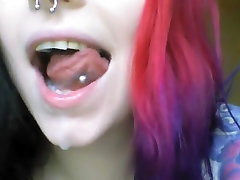 enourmus oral girl plays with her mouth and spits