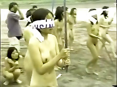 japanese nude girls splitting a watermelon with a stick while blindfolded