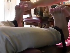 Chair tied foot tickled