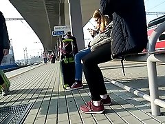 Candid girl wearing new balance sneakers waiting for a tain