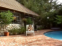 Blonde girl in sneakers takes a BBC by the pool