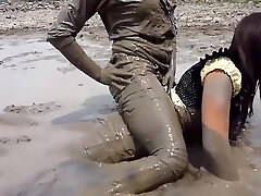 two thai girls in mud