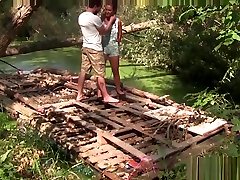 Strangers meet in the forest and fuck on abandoned raft