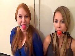Two gagged girls talk