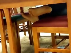 Candid bare feet in library