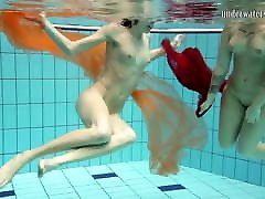 Two hotties submerged underwater