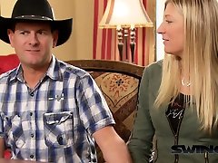 Cowboy sharing wife with stranger in a swinger group