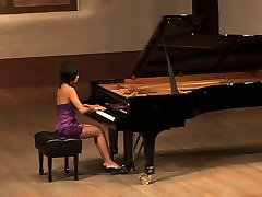 Beautiful Asian girl plays Russian composer Scriabin