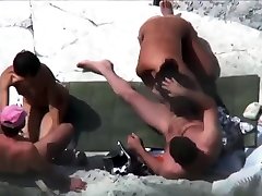 Public foursome at the nude beach