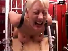 Big boobs nailed to a board, shocked and abused