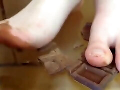 Asian wife jokes with her husband and tells him to lick his feet