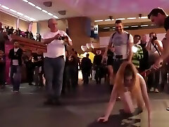 Brunette takes facial at Euro sex expo