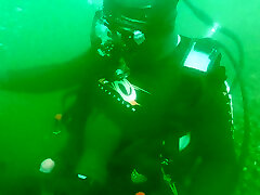 scuba diving and jerking with friend