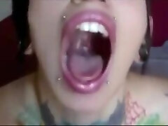 Girl opens wide tongue