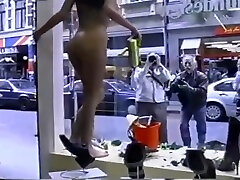 nude girl washing windows in public