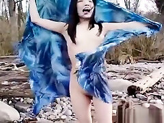 Asian slut is on the beach mastrubasi publik posing