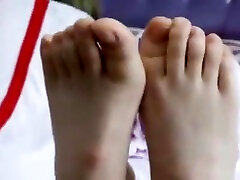 Two girls takes off shoes and shows her soft feet