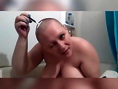 Shaving head in the tub naked