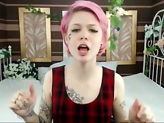 Punk rock girl with tattoos pleasures on webcam