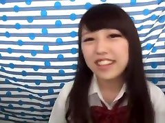 Cute Asian girl smiles as she enjoys a huge cock