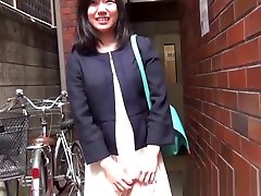 Dark haired Japanese woman slides her panties to the side